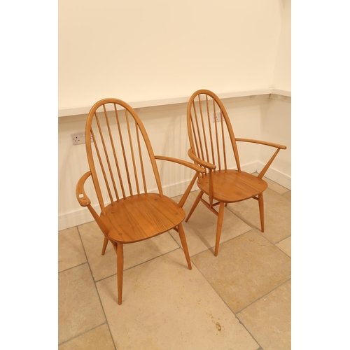 557 - A pair of light Ercol armchairs