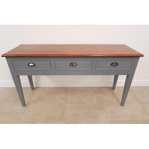 558 - A painted pine three drawer dresser base with a stained top - Width 163cm x Depth 49cm x Height 86cm... 