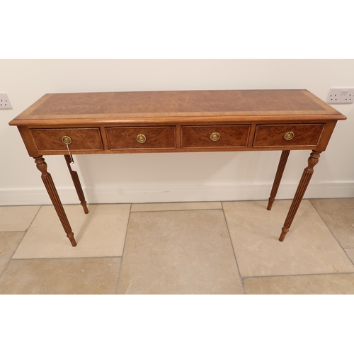 559 - A 19th century style four drawer hall table on reeded legs - 125cm x Height 76cm x Depth 32cm - made... 