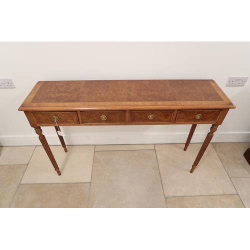 559 - A 19th century style four drawer hall table on reeded legs - 125cm x Height 76cm x Depth 32cm - made... 