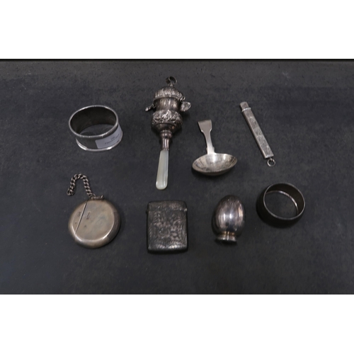 299 - Assorted silver items including - Vesta cases, William IV caddy spoon, napkin rings, babies rattle -... 