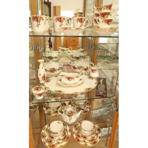 396 - A Royal Albert Country Rose dinner and tea service - please see images for item list