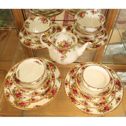 396 - A Royal Albert Country Rose dinner and tea service - please see images for item list