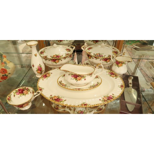 396 - A Royal Albert Country Rose dinner and tea service - please see images for item list