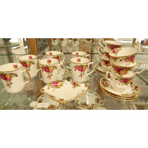 396 - A Royal Albert Country Rose dinner and tea service - please see images for item list