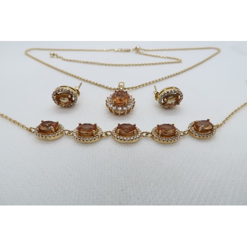 229 - A silver gilt jewellery suite with citrine pendant on chain, bracelet, ear studs