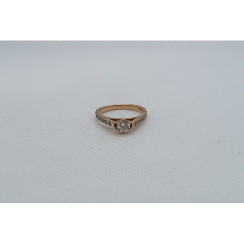 233 - An 18ct rose gold (hallmarked) diamond solitaire ring - The central diamond approx 0.2ct and set wit... 