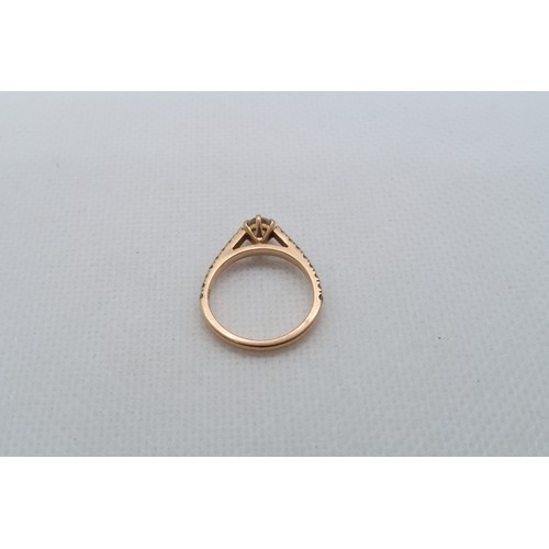 233 - An 18ct rose gold (hallmarked) diamond solitaire ring - The central diamond approx 0.2ct and set wit... 