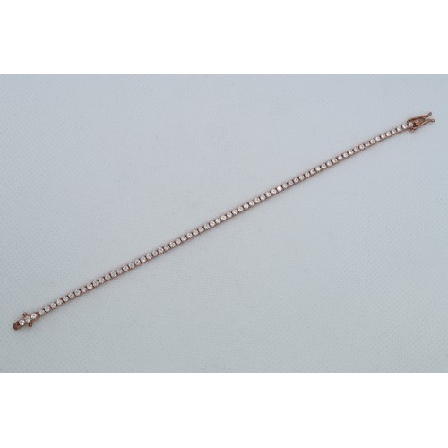 235 - A 9ct rose gold (hallmarked) and CZ tennis bracelet - 17cm - weight approx 5.3 grams