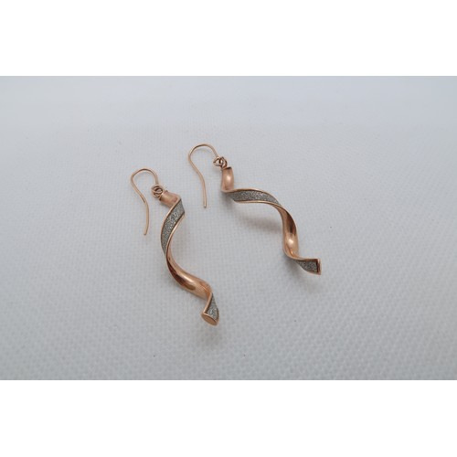 236 - A pair of approx 9ct rose gold (tested) earrings, coil shaped - 4.5cm - weight approx 1.8 grams