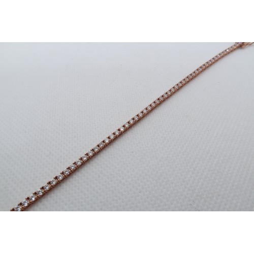 235 - A 9ct rose gold (hallmarked) and CZ tennis bracelet - 17cm - weight approx 5.3 grams