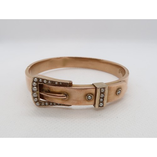 138 - An Edwardian 9ct rose gold (hallmarked) hinged buckle bangle with seed pearls - approx weight 15.1 g... 