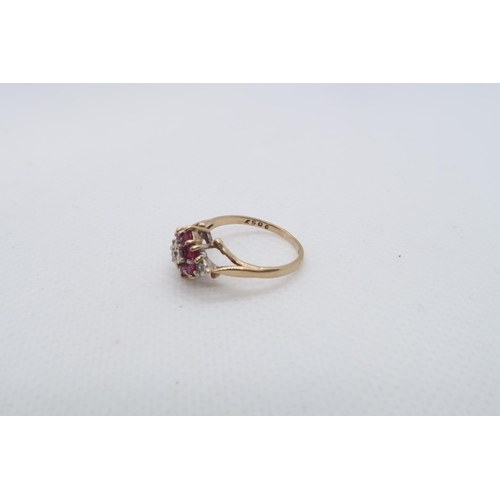 135 - A 9ct yellow gold (hallmarked) ruby and diamond cluster ring size I/J - approx weight 1.8 grams