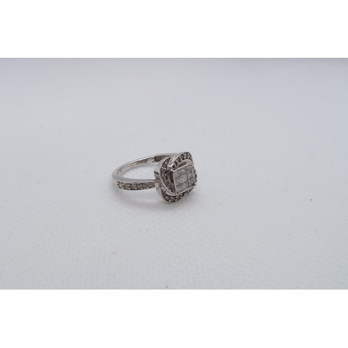 133 - A 9ct white gold (hallmarked) diamond cluster ring with nine central square cut diamonds - ring size... 