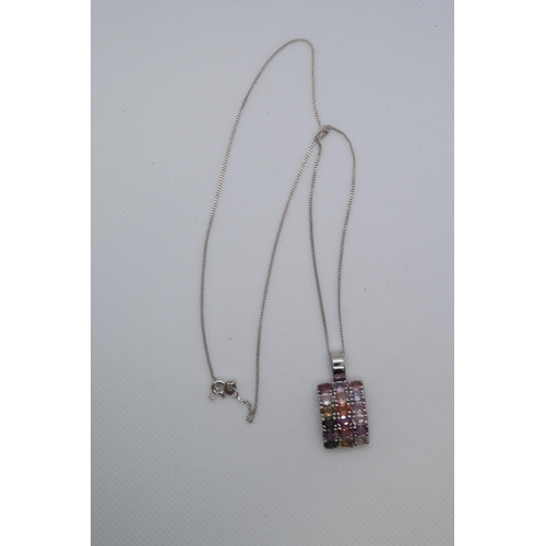 136 - A 9ct white gold (hallmarked) pendant with coloured stones - 3cm (in ring) approx weight 5 grams - o... 