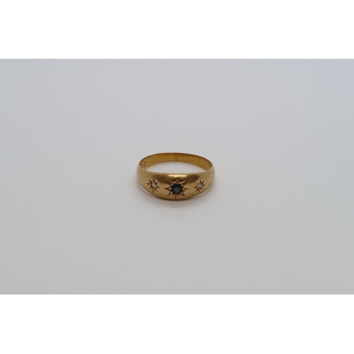 102 - An 18ct yellow gold (hallmarked) gypsy ring with diamonds and sapphires - ring size Q - 4 grams