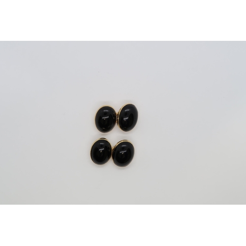 109 - A pair of approx 18ct (tested) yellow gold and Onyx cufflinks - approx weight 13.4 grams