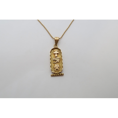 114 - An Egyptian 18ct (hallmarked) yellow gold pendant, 3cm, on 18ct (hallmarked) yellow gold chain - 50c... 