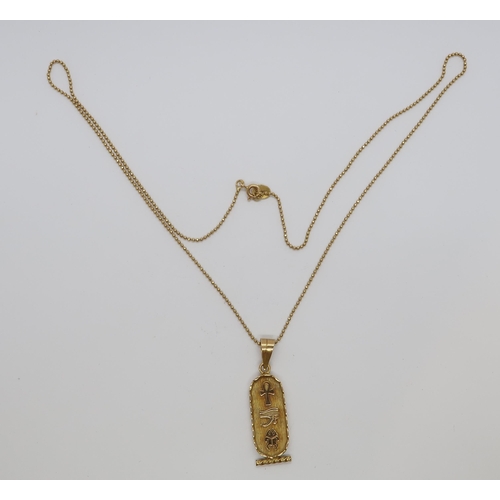 114 - An Egyptian 18ct (hallmarked) yellow gold pendant, 3cm, on 18ct (hallmarked) yellow gold chain - 50c... 