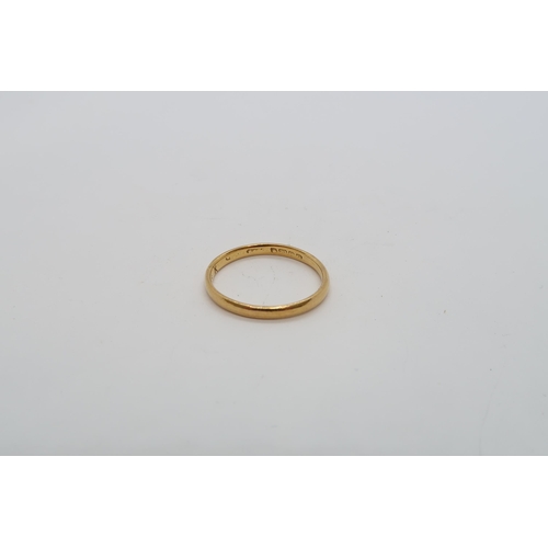 124 - A 22ct (hallmarked) yellow gold wedding band size L - weight approx 1.8 grams