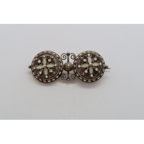 129 - A silver hallmarked filigree and white enamel brooch, 4cm