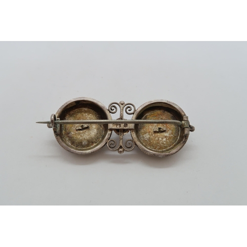 129 - A silver hallmarked filigree and white enamel brooch, 4cm