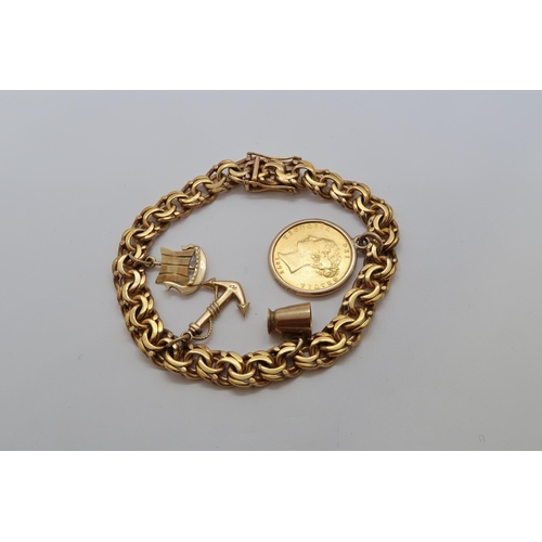 131 - A gold coloured charm bracelet with an 1872 gold half sovereign, two 9ct charms and one 14ct charm