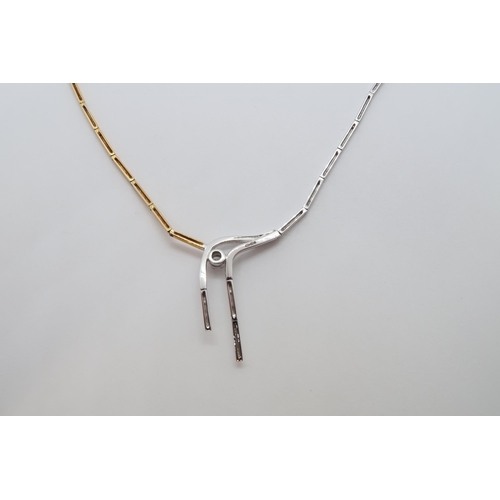 148 - An 18ct hallmarked bi-colour gold necklace set with diamond, approx 42cm long, approx 10.2 grams