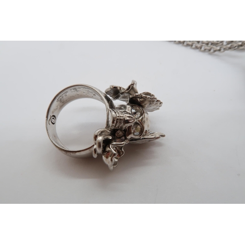 155 - An Alexander McQueen skull pendant on chain, pendant 3cm, together with an Alexander McQueen ring, s... 