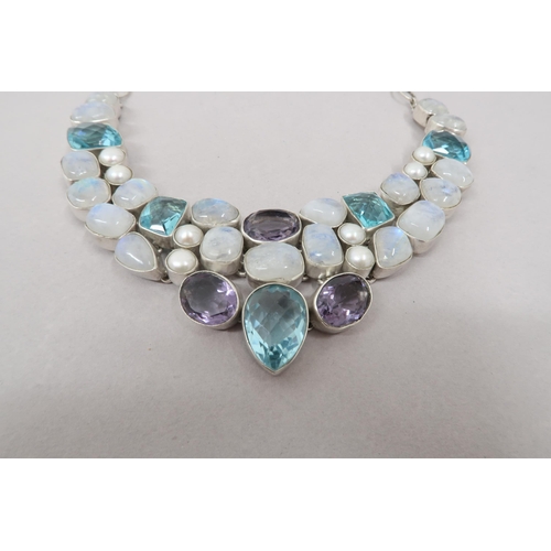 162 - A modernist sterling silver moon stone, blue zircon, amethyst and pearl necklace