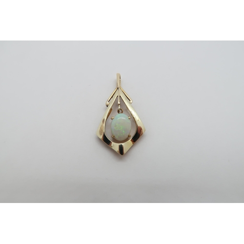 174 - A 14ct (hallmarked) yellow gold and opal pendant - 3cm - weight approx 2.6 grams