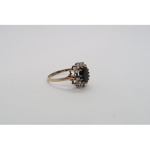 178 - A sapphire and diamond cluster ring, one diamond missing - ring size O/P - approx weight 1.9 grams