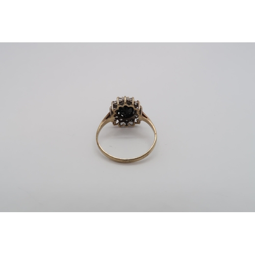 178 - A sapphire and diamond cluster ring, one diamond missing - ring size O/P - approx weight 1.9 grams