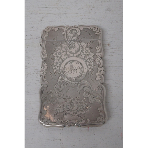 213 - A Victorian silver card case, Alfred Taylor, Birmingham 1856 - with finely chased decoration - good ... 