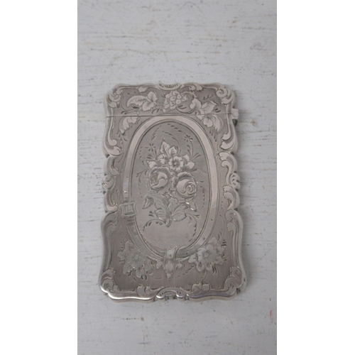 213 - A Victorian silver card case, Alfred Taylor, Birmingham 1856 - with finely chased decoration - good ... 