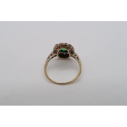 23 - A 14ct hallmarked emerald and diamond cluster ring with diamond accent shoulders, size L, approx 2.8... 