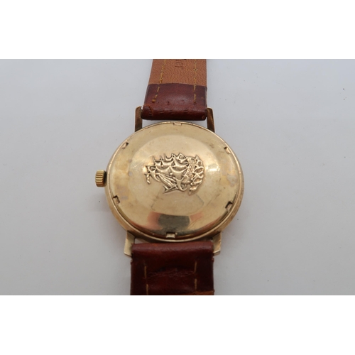 255A - A gents 9ct gold cased Longines Flagship automatic wristwatch - case 34mm - with date aperture - wor... 