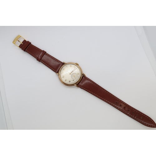 256A - A gents 9ct gold cased Longines manual wind wristwatch - case 34mm - with seconds sub dial - working... 