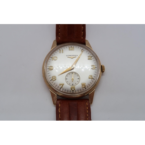 257A - A gents 9ct gold cased Longines manual wind wristwatch - case 33mm - with seconds sub dial - working... 