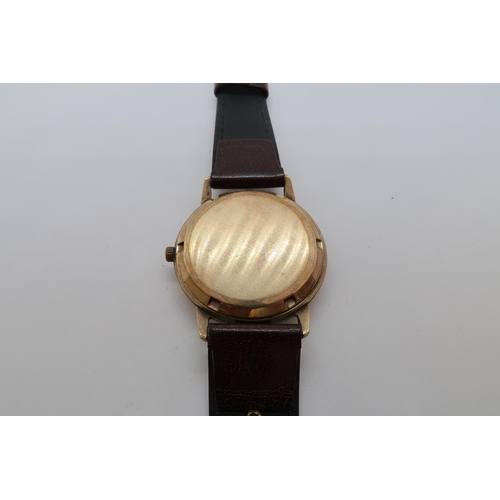 258A - A gents 9ct gold cased Omega Seamaster Geneve Automatic wristwatch - case 34mm - working in the sale... 