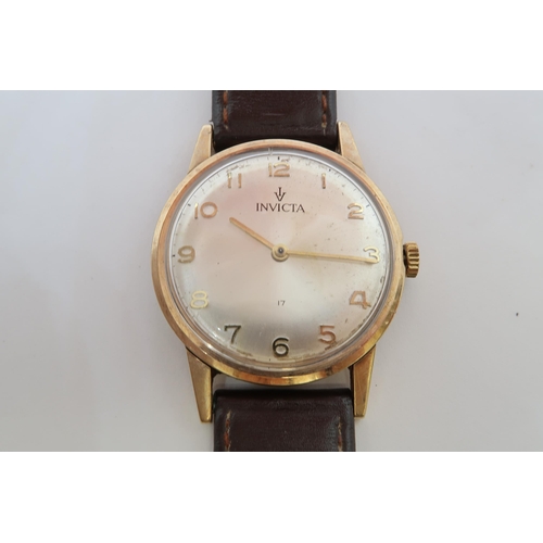 271A - A gents 9ct gold cased Invicta manual wind wristwatch - case 33mm - working in the saleroom