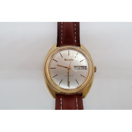 274A - A gents Bulova automatic gold plated wristwatch - case 34mm - with day and date aperture - working i... 