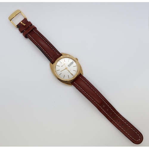 274A - A gents Bulova automatic gold plated wristwatch - case 34mm - with day and date aperture - working i... 