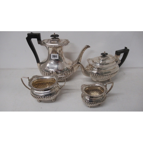 291 - An Edwardian silver three piece tea set - Thomas Hayes, Birmingham 1904 with a matched late Victoria... 