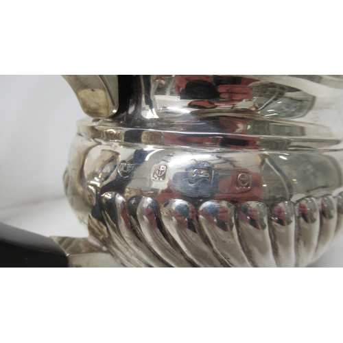 291 - An Edwardian silver three piece tea set - Thomas Hayes, Birmingham 1904 with a matched late Victoria... 