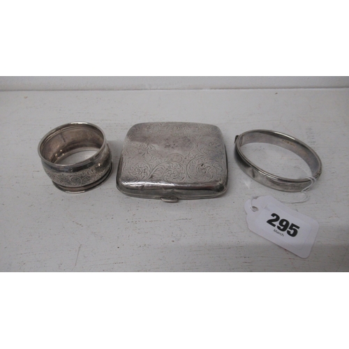 295 - A silver cigarette case, hinged, bangle and napkin ring - approx weight 4 troy oz