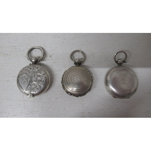 311 - A Georgian silver pill box/locket pendant, 3cm - together with a Victorian silver sovereign case, Bi... 