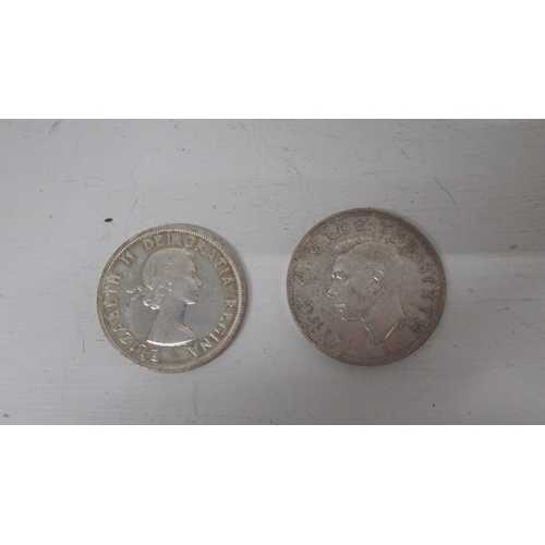 326 - Two silver coins: 1959 .800 silver dollar Canada, and 1949 .500 silver crow New Zealand