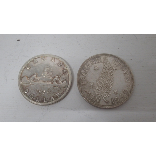 326 - Two silver coins: 1959 .800 silver dollar Canada, and 1949 .500 silver crow New Zealand