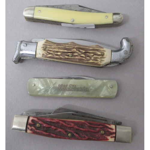 361 - Four pocket pen knives, one inlaid with a picture of Siberia